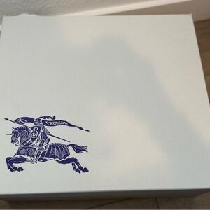 Burberry White Box with Black Text and Tan Boot Illustration